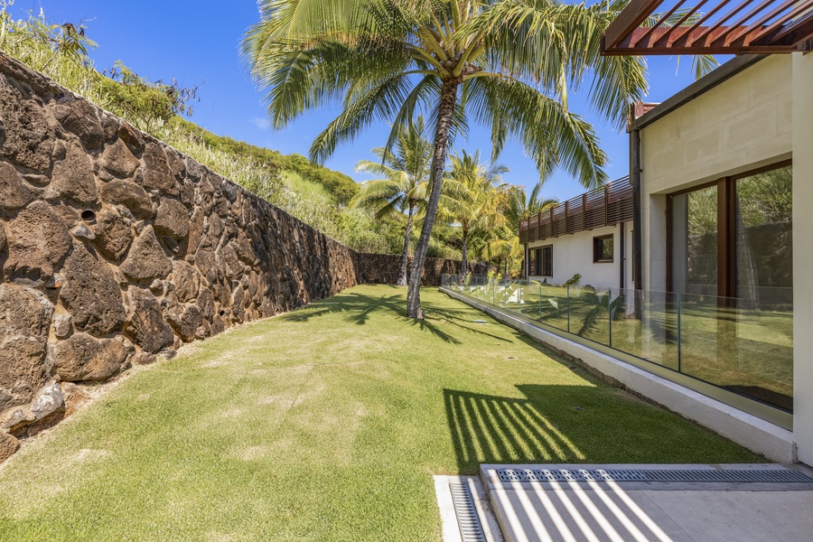 An expansive estate showcasing modern architecture and tropical surroundings.