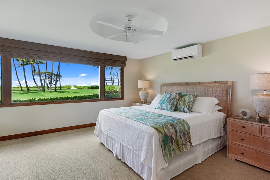 Downstairs guest bedroom with a cozy kingD-size bed and serene ambiance.