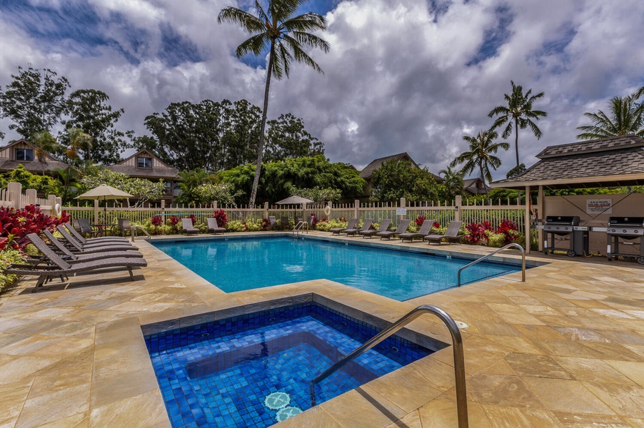 Take a refreshing dip in the pool under the radiant Hawaiian sun—a true tropical delight.