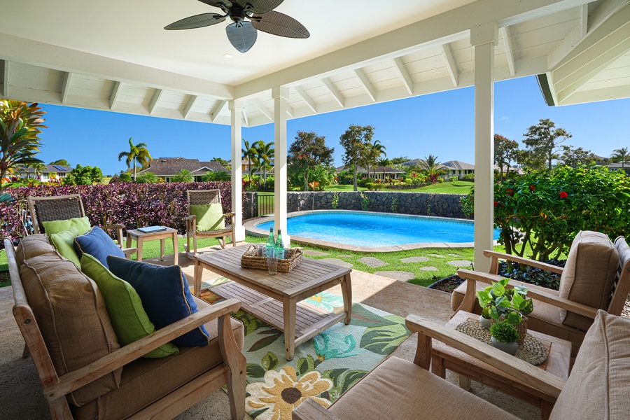 Covered lanai with pool and views of the Kiahuna golf course