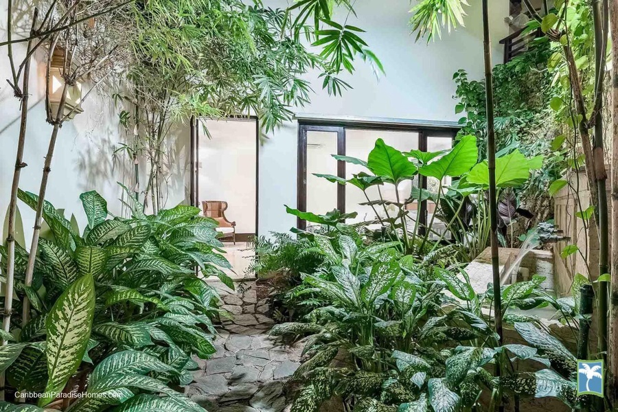 A serene garden pathway, surrounded by vibrant plants and tranquil ambiance.