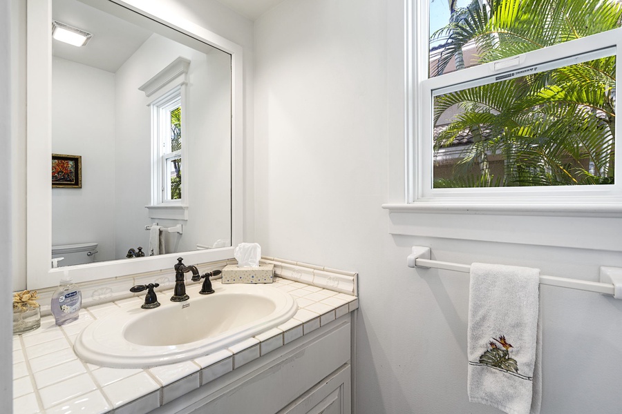 Convenient powder room located near the main level entry for guest use.