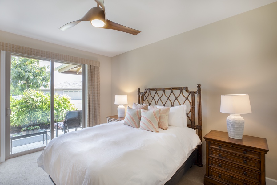 Enjoy direct lanai access and peaceful garden views from the guest bedroom—ideal for early risers seeking serenity.