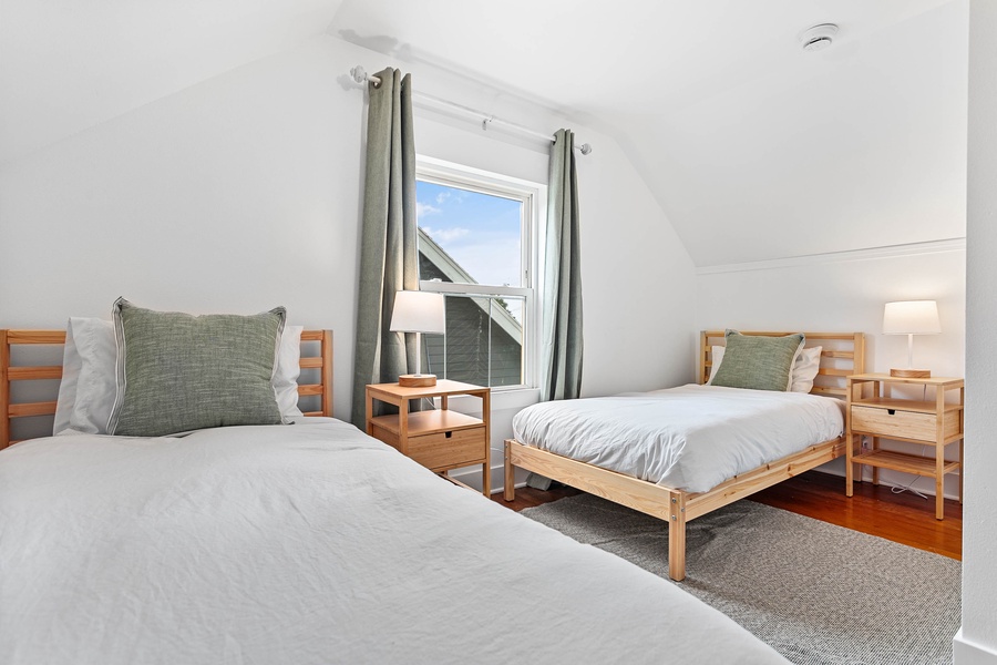 Perfect for families or friends, this twin bedroom offers ample storage and peaceful vibes.