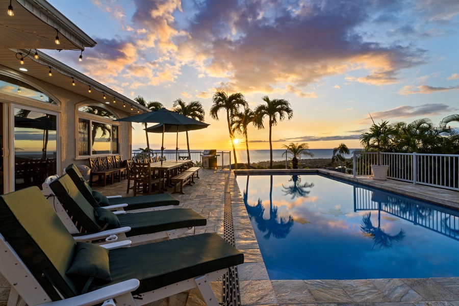 Spectacular sunset views paint the sky as you unwind by your private pool surrounded by swaying palms.