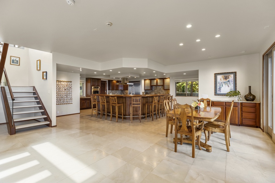 The kitchen overlooks the formal dining area which comfortably seats 6