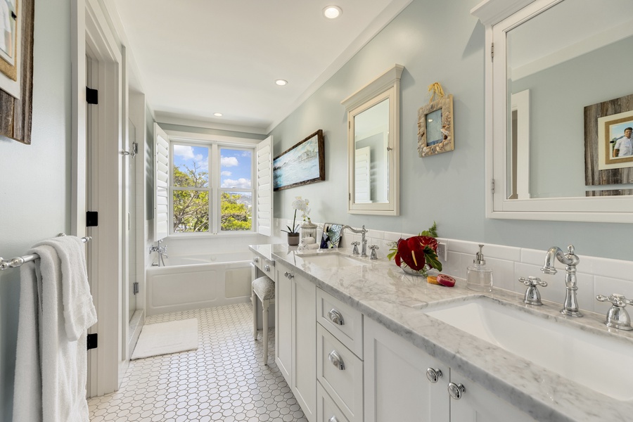 Primary ensuite with dual vanity and soaking tub