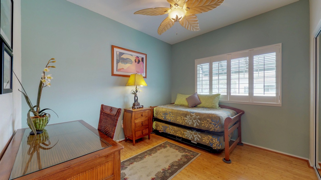 The third guest bedroom upstairs has twin trundle beds and a desk.