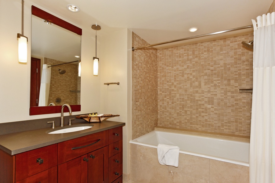 The second guest bathroom with a shower and tub.