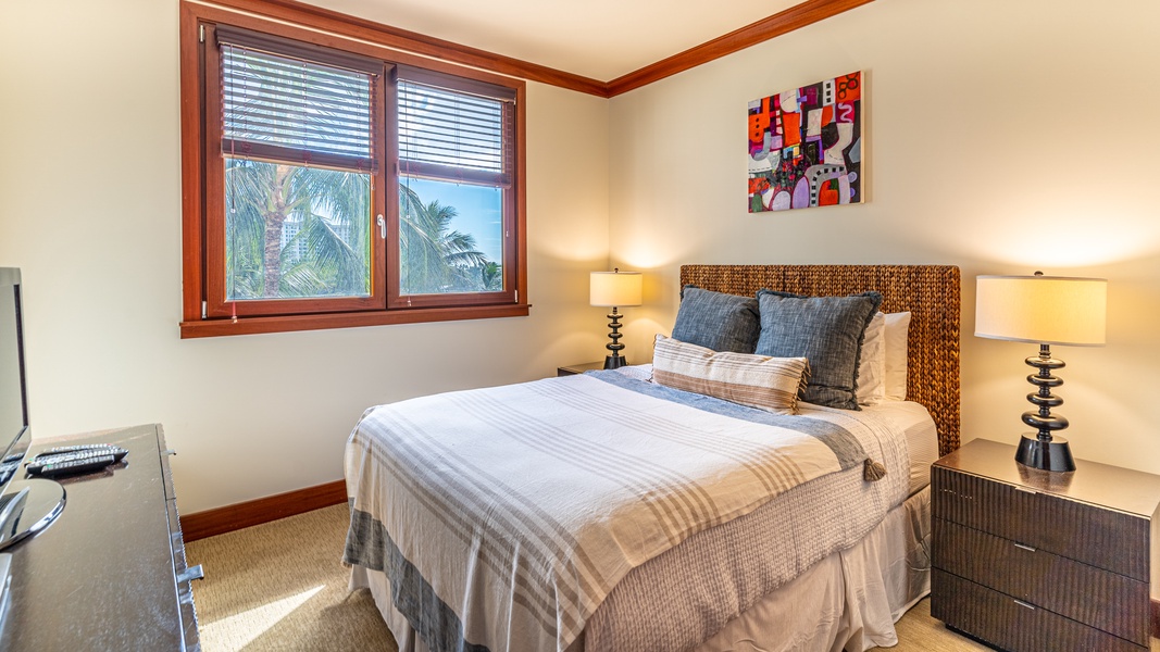 The second guest bedroom with comfort and views.