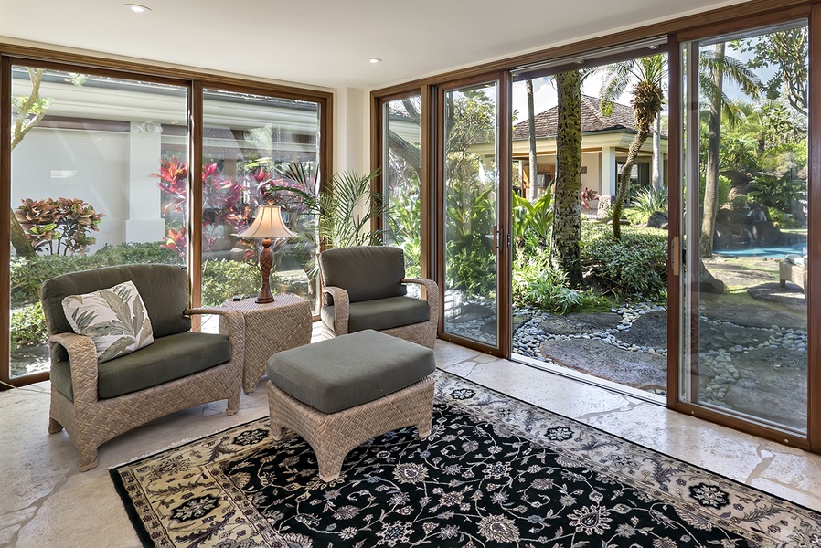 Main house: Guest Bedroom 2 sun room with pool and garden court yard access.