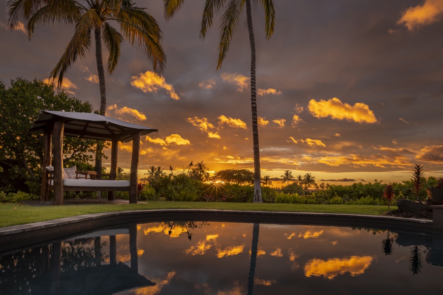 Take a dip & enjoy tropical luxury beneath amber skies