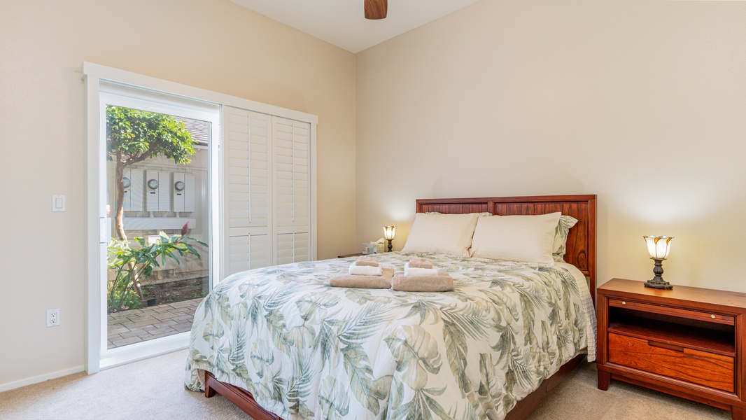 The guest bedroom on the first floor has access to the private lanai.