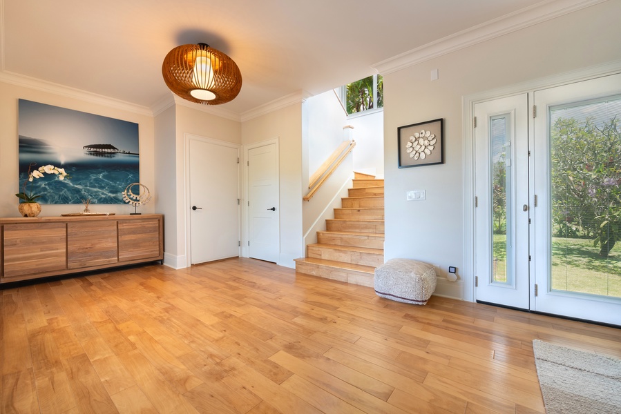 Entryway featuring warm wood floors and a welcoming ambiance.