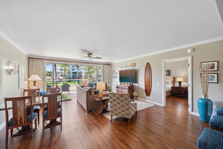 Natural light floods the living and dining room of Honua Kai Konea 204, creating a welcoming and airy ambiance.