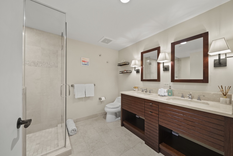 The ensuite bathroom is spaciously designed with dual sink vanity.