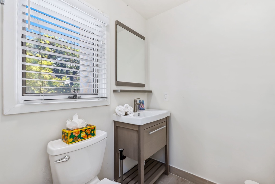 Bright guest bathroom with clean finishes and natural light—simple, fresh, and functional.