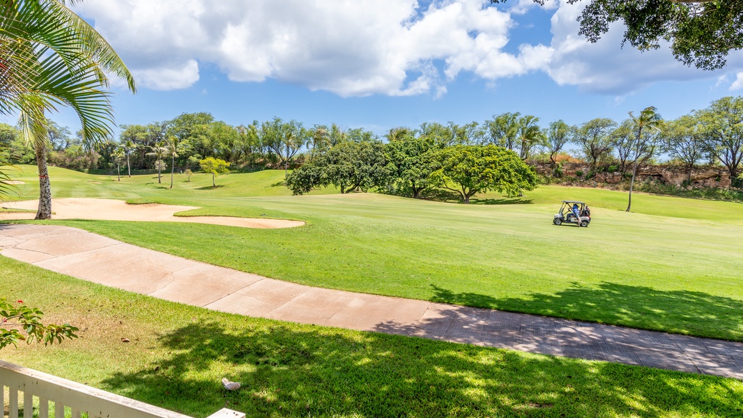 Scenic golf course with lush fairways and mature trees creating a peaceful tropical setting.