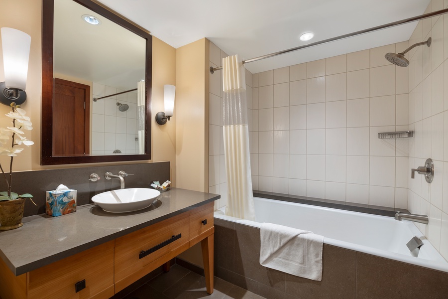 The second full bath features a deep soaking tub, shower combo, and resort-quality amenities.