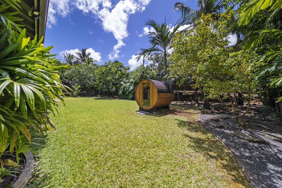 Finnish-style barrel sauna tucked into a tranquil garden setting—relax and rejuvenate outdoors.