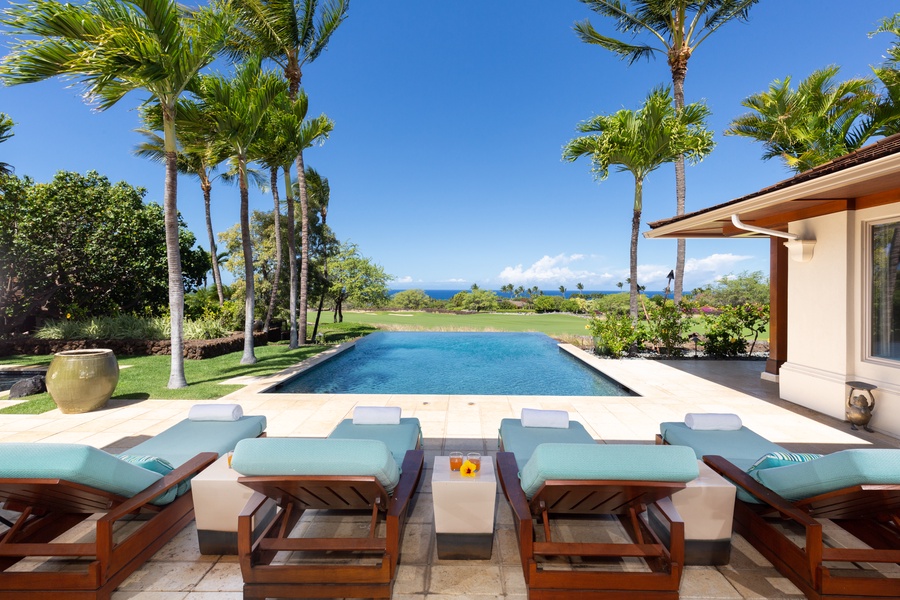 Sit back, relax, & soak in the views of the vividly blue Pacific past the infinity pool