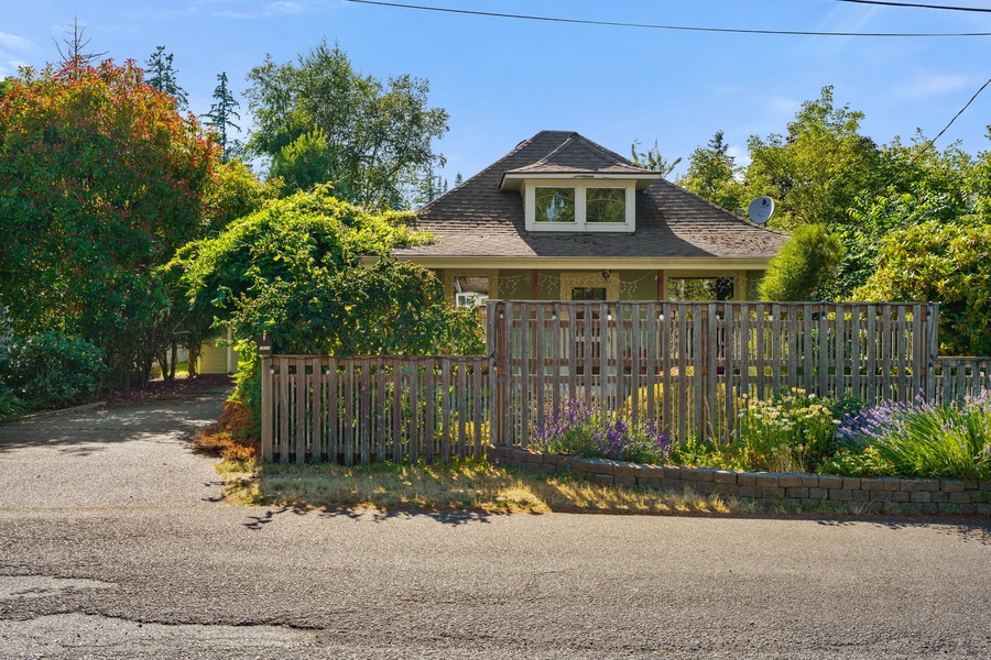 Nestled behind a charming fence, this home exudes privacy and warmth, perfect for a relaxing stay.