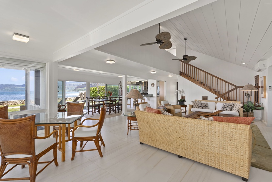 Your spacious open-plan living area with stunning ocean views and tropical ceiling fans keeping you cool.