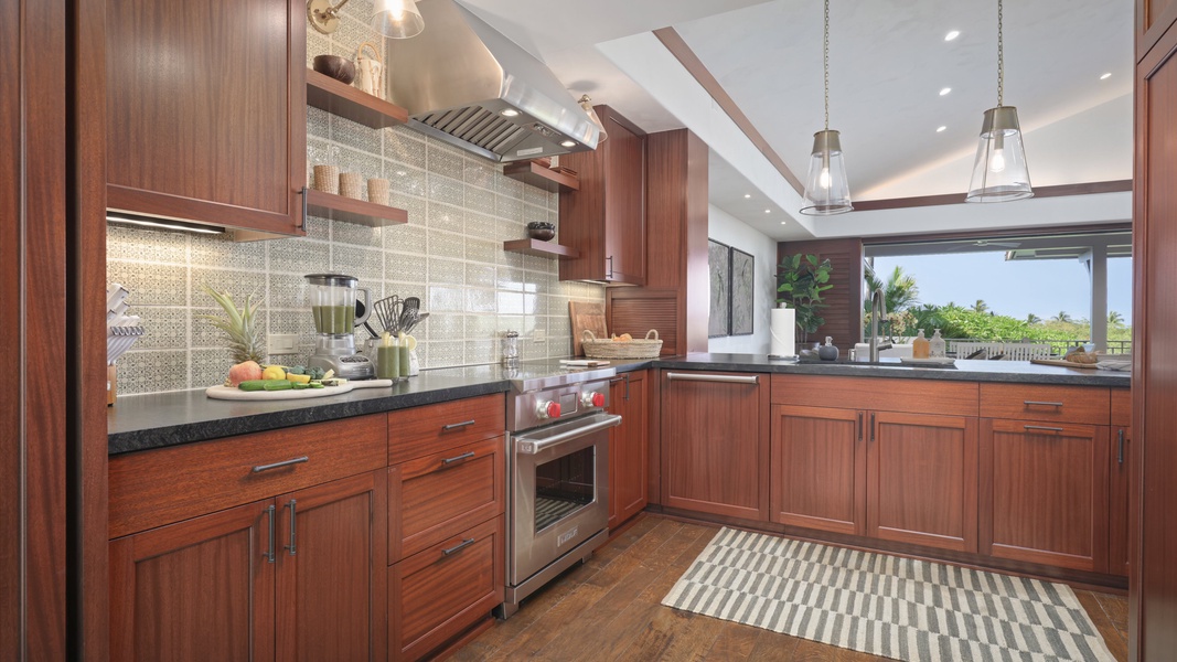 The spacious kitchen area features wide counter spaces for a breezy meal prepping.