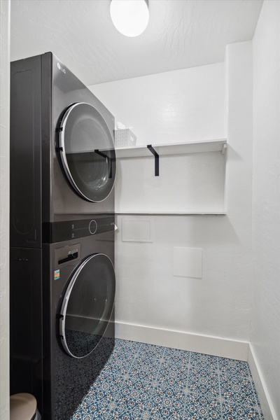 Roomy laundry space with a washer and a dryer.