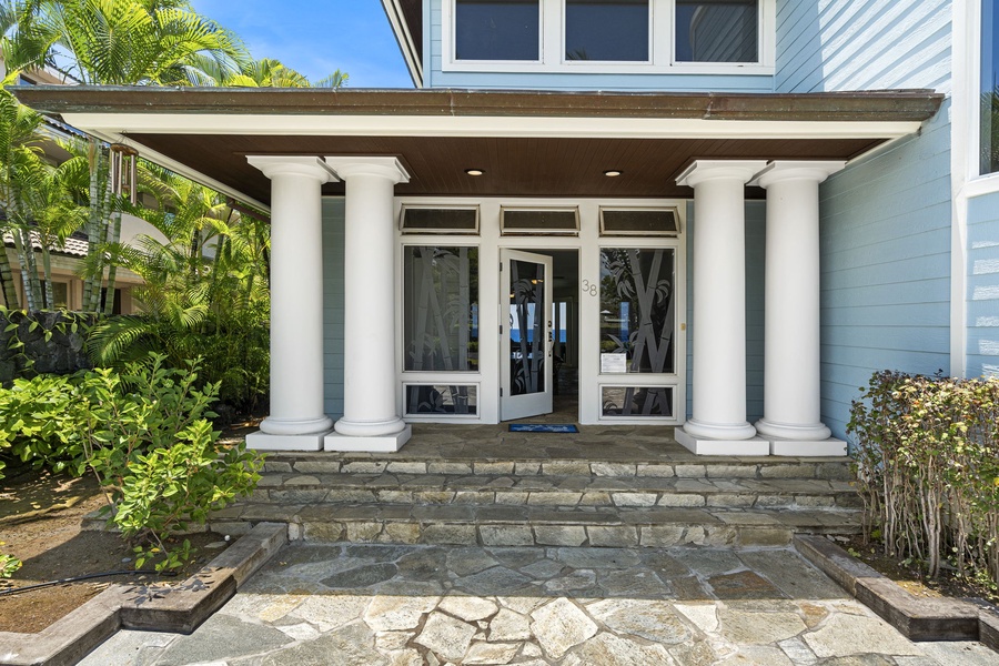 Grand front entry welcomes guests into this stunning oceanfront retreat.