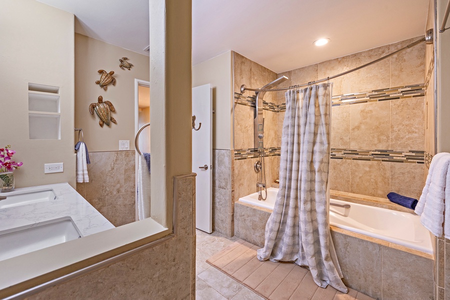 The guest ensuite has shower/tub combo.