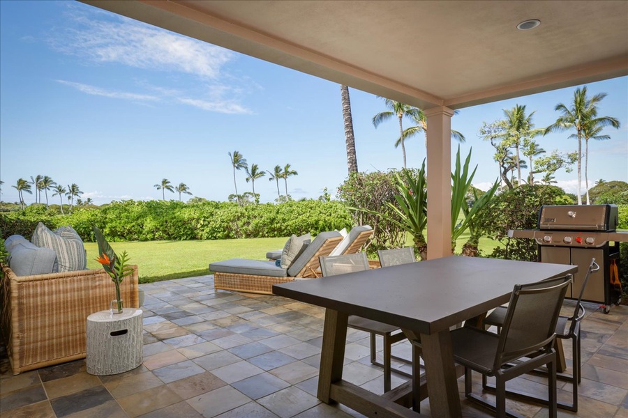 Spacious and well appointed lanai with BBQ grill opens to a gorgeous lawn and manicured fairways.