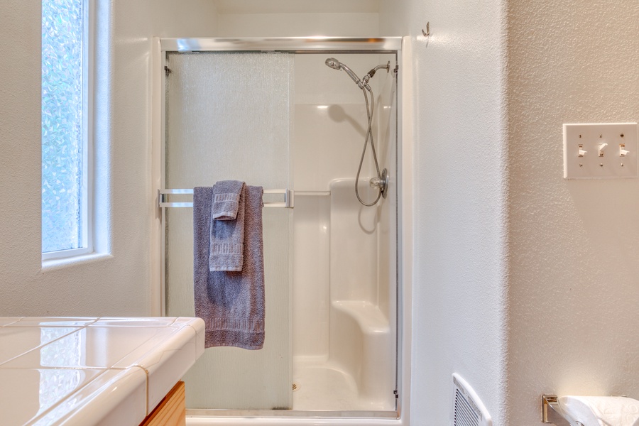 Walk-in shower with sliding doors