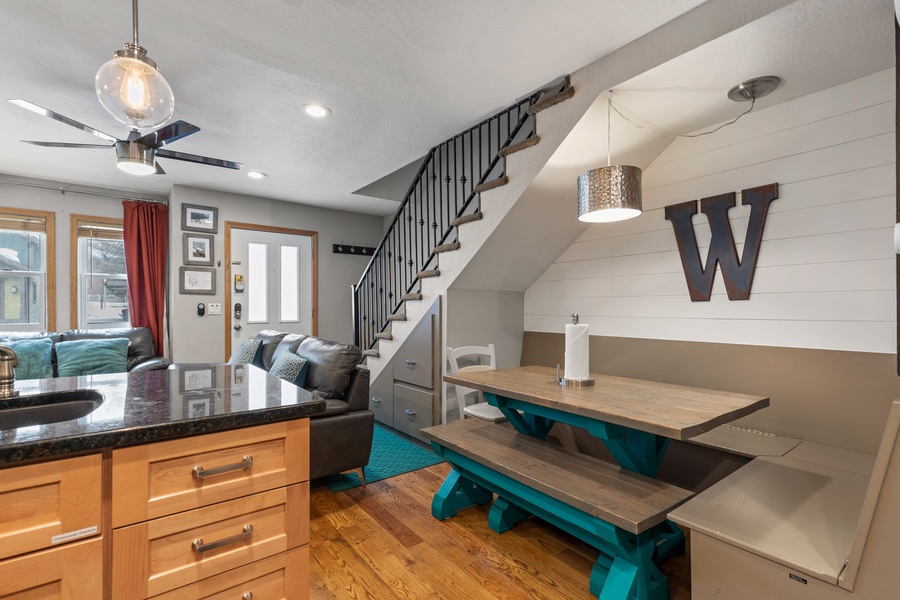 The dining area is a great space to enjoy time with friends and family, where a six-person wood table is the perfect place to Gather for meals