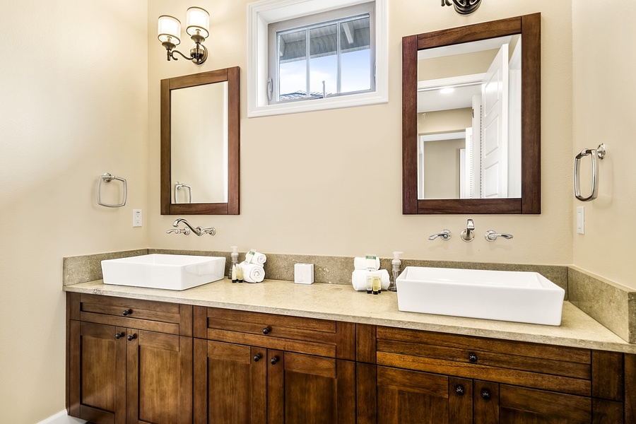 Downstairs guest bathroom with dual vanities
