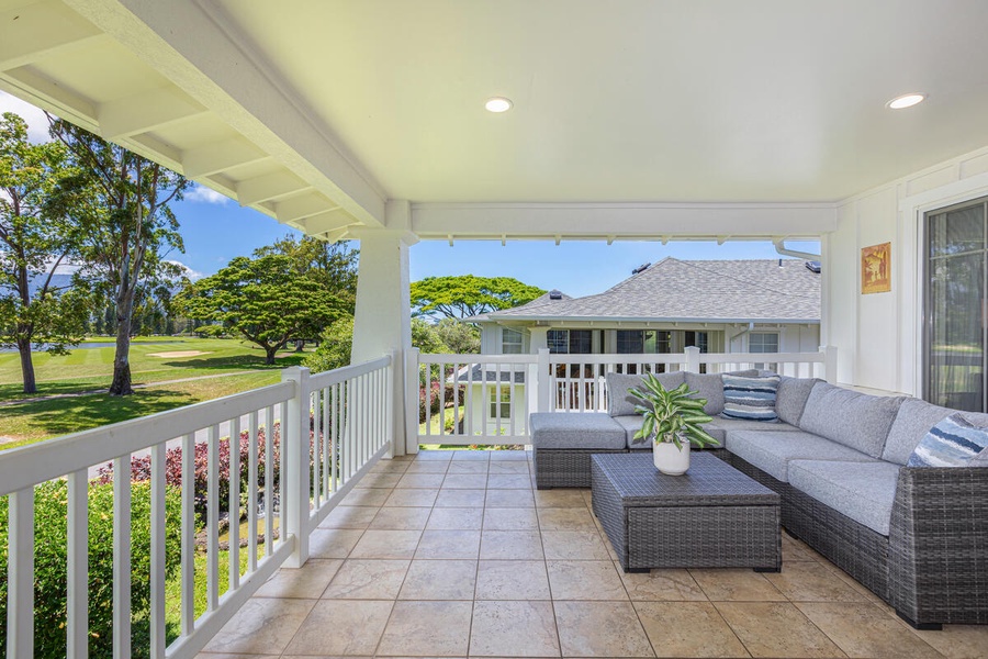 Relaxing outdoor lanai with comfortable seating and serene views.