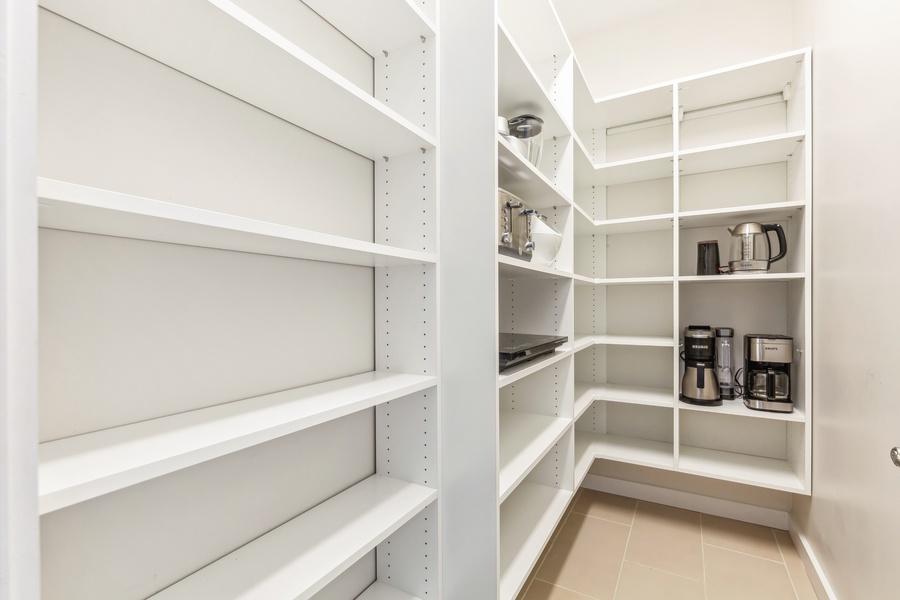 Organized pantry with spacious shelving for all your kitchen essentials.