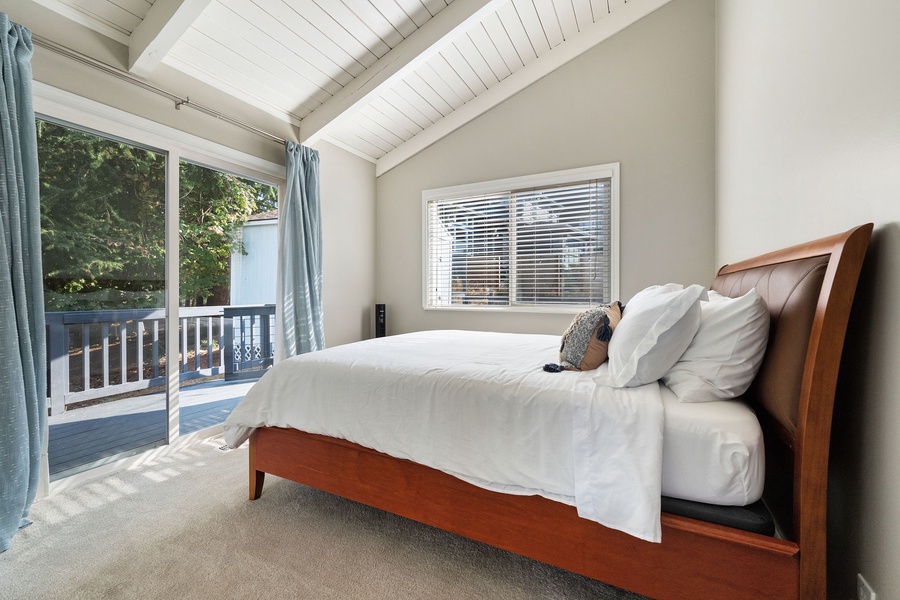 Welcome to the guest room amplified with scenic views through the glass door and window