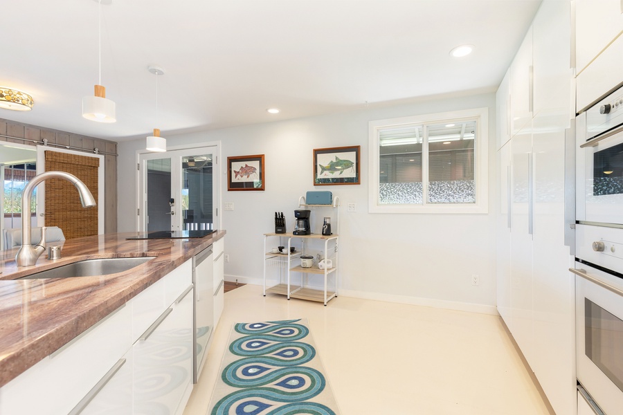 Spacious countertops and updated cabinetry make this modern kitchen both functional and stylish.