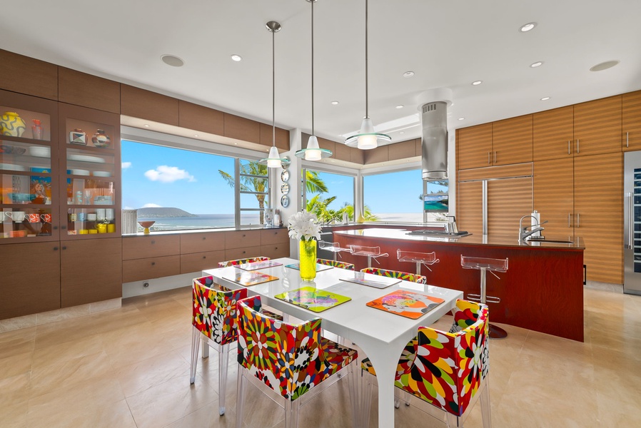 Colorful dining space with vibrant seating, modern lighting, and expansive ocean views.