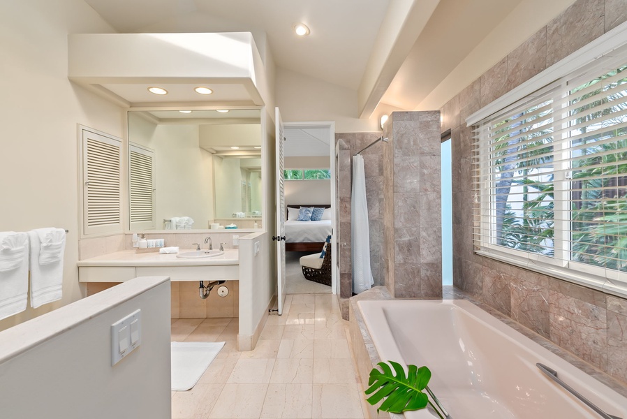 Indulge in your private spa-like retreat with marble accents, soaking tub, and elegant finishes that transform your daily routine into luxury.
