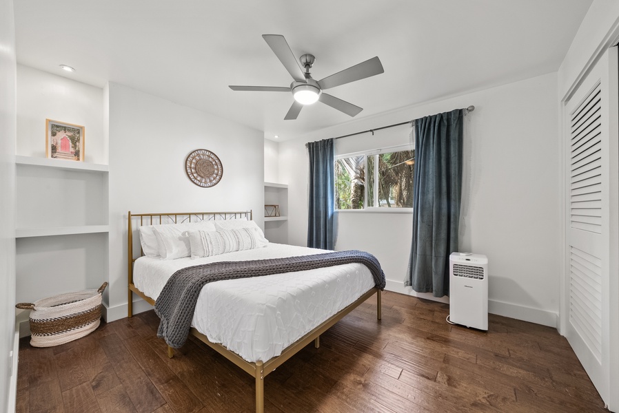 Comfortable bedroom with soft natural light, modern furnishings, and a relaxing vibe.