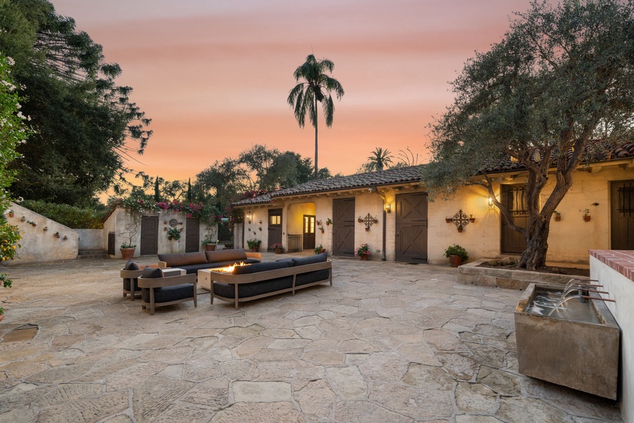 Gather around the fire pit as golden sunset light bathes your private courtyard retreat.
