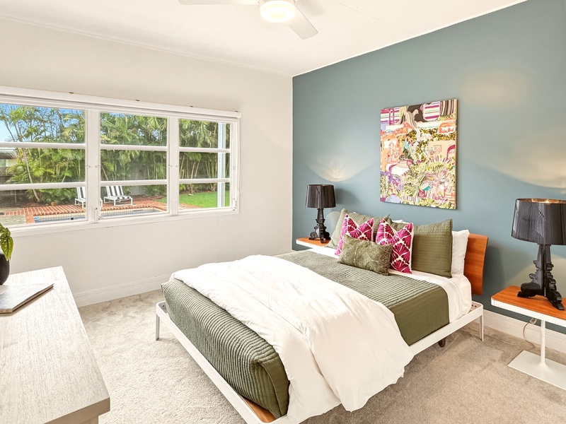 Your bright bedroom features garden views, stylish decor, and crisp linens for perfect relaxation.