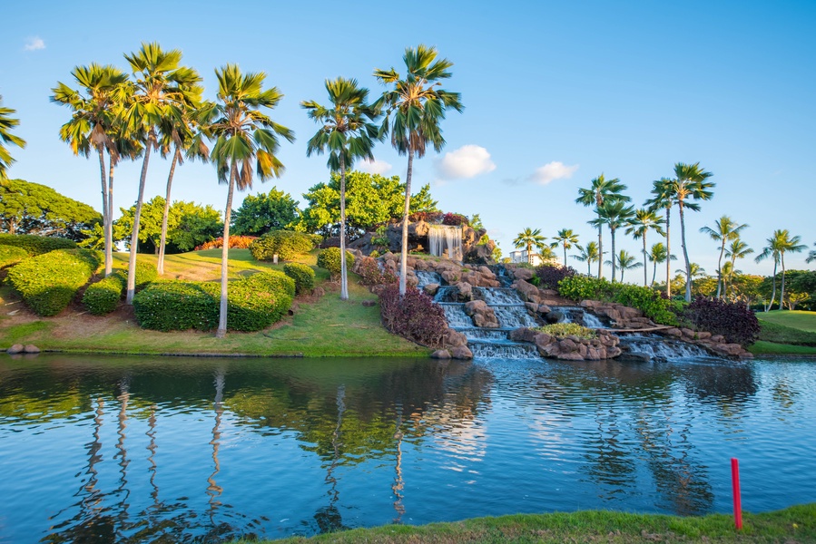 Take in the waterfalls on the golf course, the towering palms and tropical landscape.