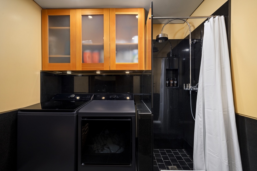 Your sleek studio combines modern kitchen and spa-like shower in one efficient space, perfect for culinary adventures and refreshing moments.