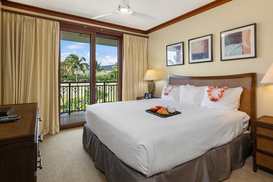 Primary bedroom with king bed and TV