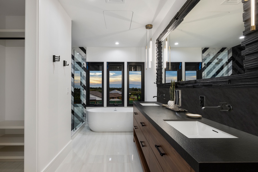 Refresh in the spa-inspired ensuite, designed for tranquil moments with panoramic sunset views.