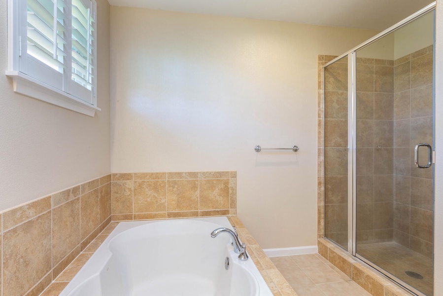 Soak in the tub and enjoy a spa-like retreat in this spacious bathroom.