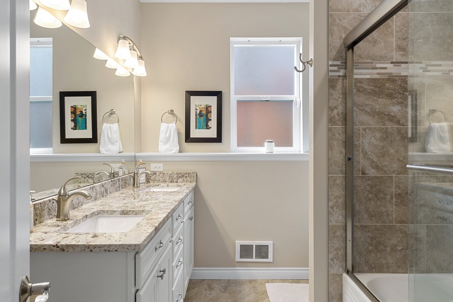 An elegant common bathroom on the first floor, a refined space that exudes timeless charm and functionality